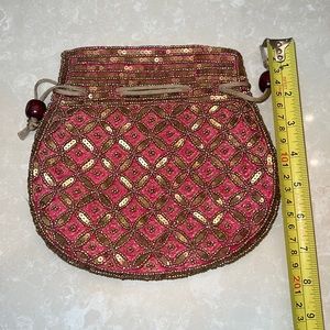 New beaded pouch clutch. Handmade in India. Perfect condition.